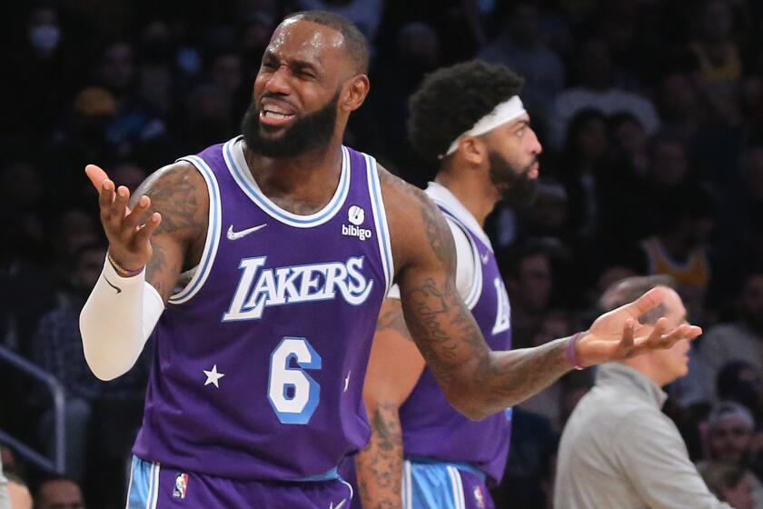 LOS ANGELES, CALIF. - DEC. 3, 2021. Lakers forward LeBron James reacts to being called for a foul against the Clippers in the third quarter of Friday night's game, Dec. 3, 2021, in Los Angeles. (Luis Sinco / Los Angeles Times)