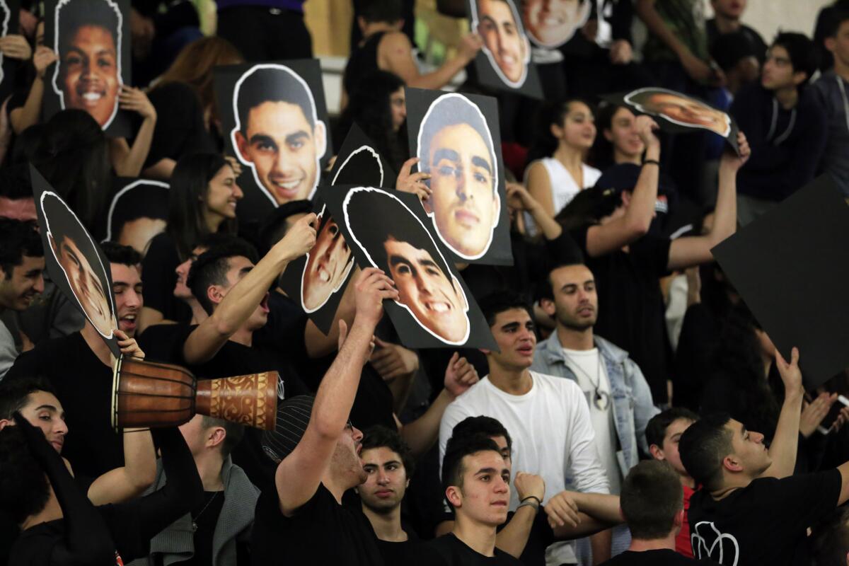 Beverly Hills High School basketball fans cheer during a game against Santa Monica on Tuesday.
