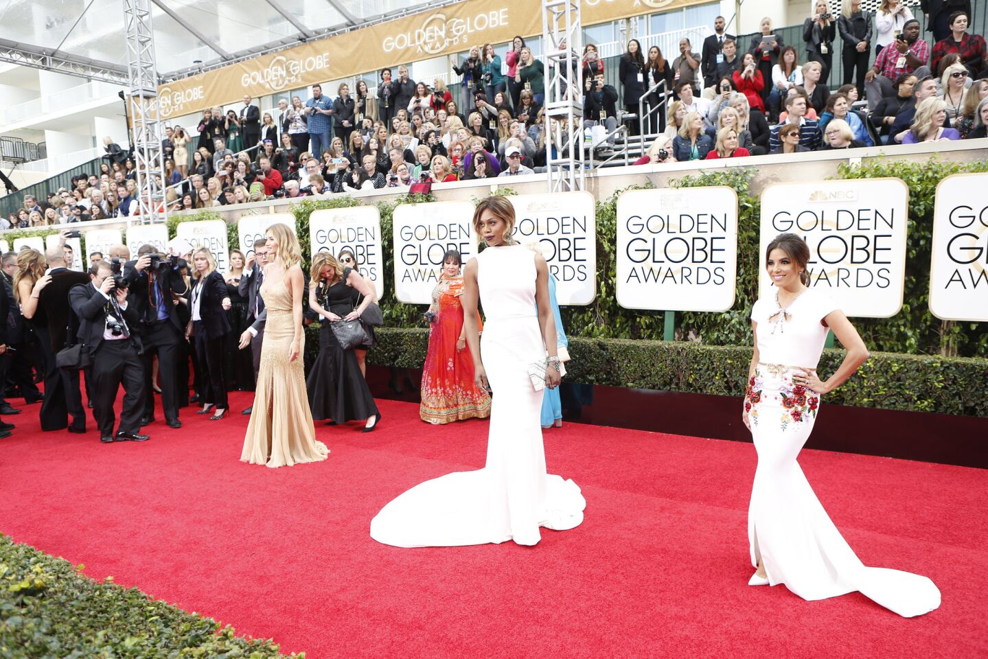 Rosie Huntington-Whiteley, from left, Laverne Cox and Eva Longoria on the red carpet.