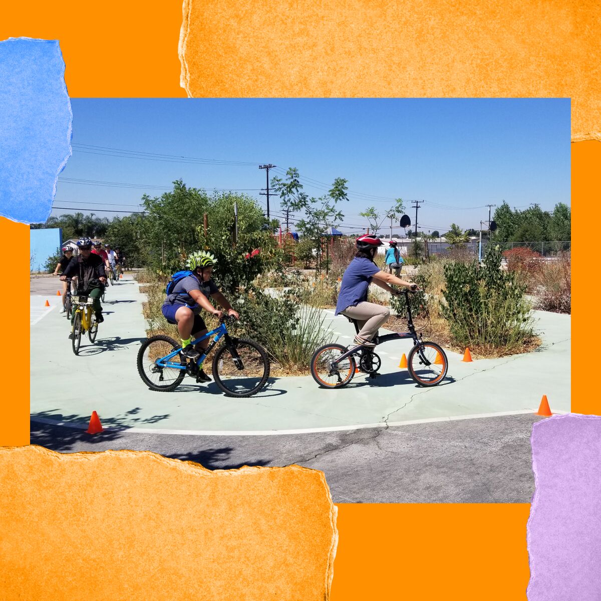 People on bikes and wearing helmets cycle in a parking lot with small orange cones.