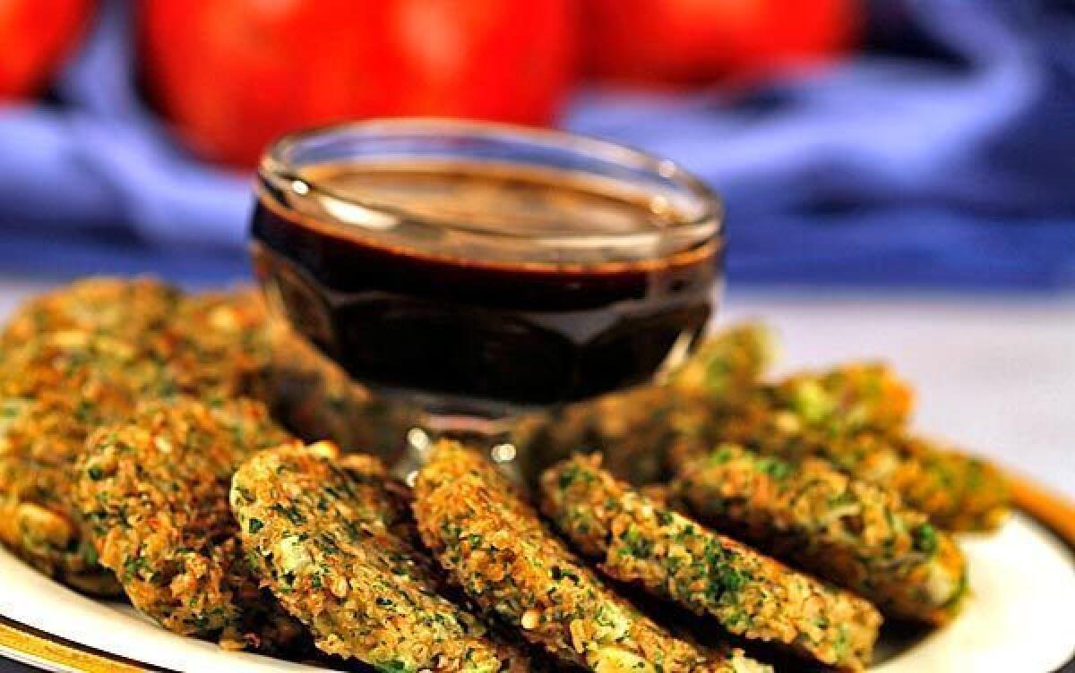 Bulgur latkes with pomegranate sauce.