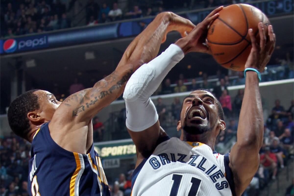 Memphis Grizzlies guard Mike Conley shoots against Indiana Pacers guard George Hill on Saturday.
