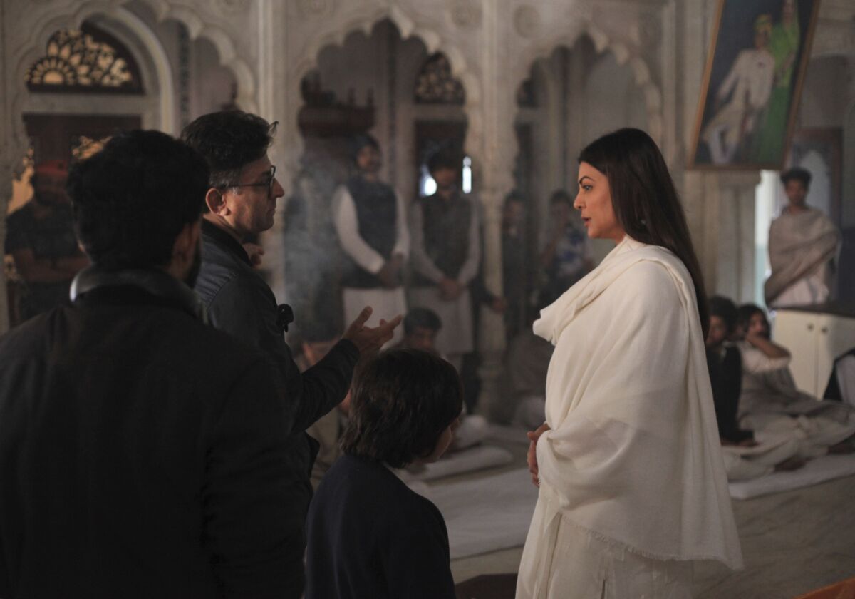 In this photo provided by Disney+Hotstar, Bollywood filmmaker Ram Madhvani, left, explains a scene to Bollywood actress Sushmita Sen on the sets of web series 'Aarya' in India. One of the most popular Indian web shows streamed on Disney+ Hotstar, ‘Aarya’ is nominated in the best drama category and is an official remake of the Dutch crime drama Penoza. (Disney+Hotstar via AP)