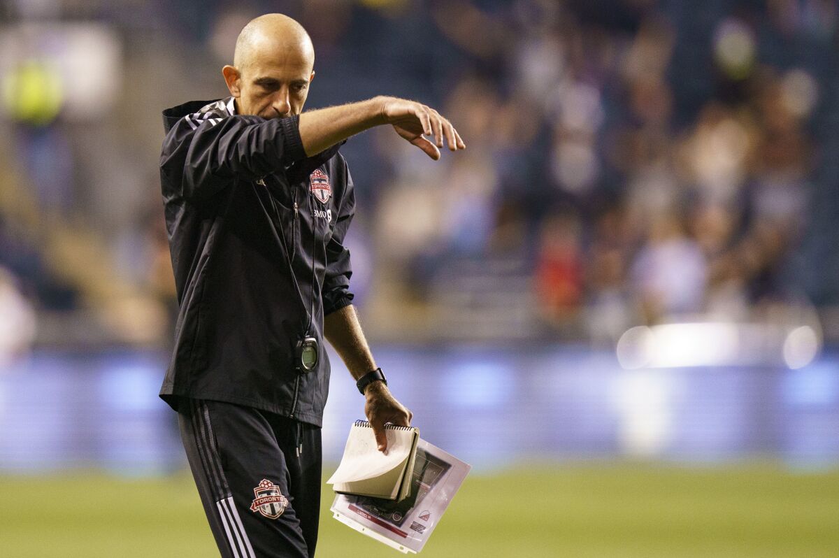 Toronto FC head coach Javier Perez reacts as he heads off the field following the second half of an MLS