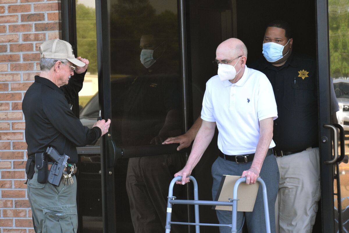 Paul West, center, is escorted by deputies from the Leflore County Civic Center in Greenwood, Miss., on Wednesday, April 13, 2022, after a jury found him guilty of sexually abusing a student at St. Francis of Assisi School in the 1990s. West, a former Franciscan friar, worked as a teacher and then principal at the Catholic school in Greenwood. Circuit Judge Ashley Hines sentenced West to 30 years on the first count and 15 years on the second. (Tim Kalich/The Commonwealth via AP)