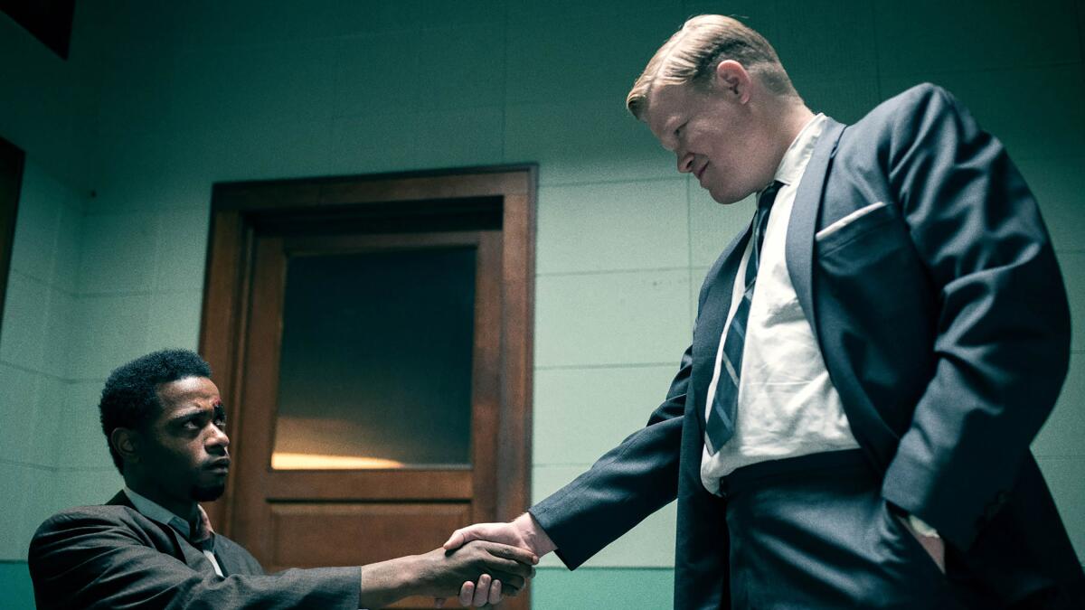 Lakeith Stanfield and Jesse Plemons shake hands