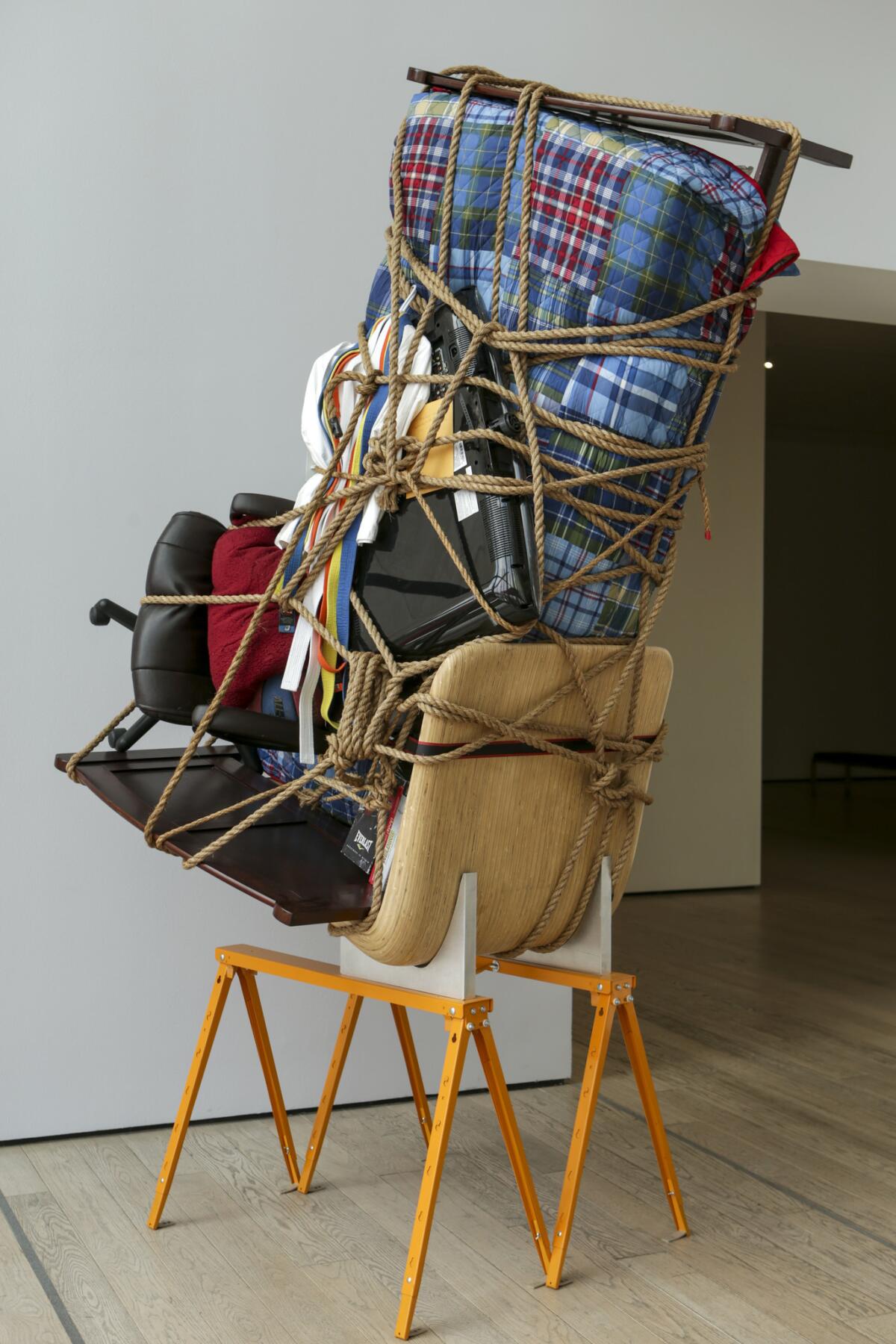 An installation view of Juan Manuel Montes' belongings in "Temporary Storage" in "Home: So Different, So Appealing," at LACMA. (Irfan Khan / Los Angeles Times)