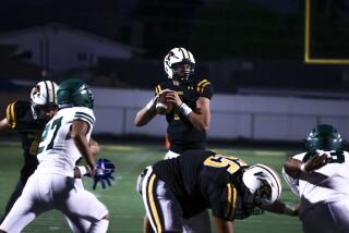 Newbury Park, CA - September 06: Newbury Park Quarterback Brady Smigiel (7) looks down.