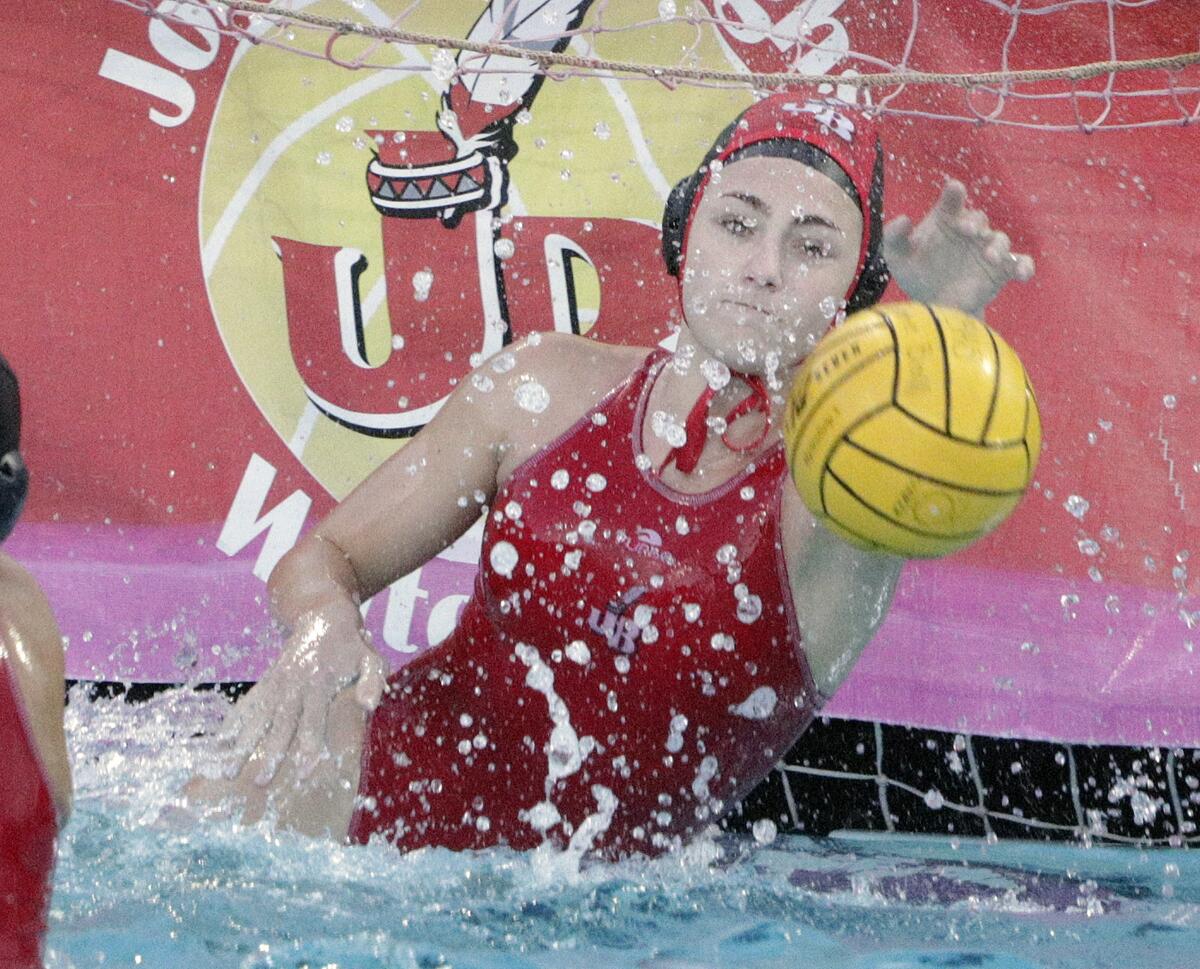 Burroughs' goalie Ema Nathan saves the ball off of a Santa Ana shot in the first round of the CIF Southern Section Division V girls' water polo playoffs at Burroughs High School on Tuesday, February 11, 2020. Burroughs won the game and advances.