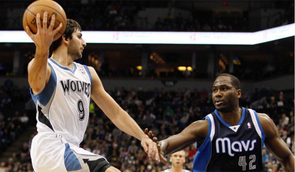 Minnesota's Ricky Rubio tries to pass the ball around Dallas' Elton Brand; a Lakers sweep of the Timberwolves would be a major step toward moving up a spot in the standings.
