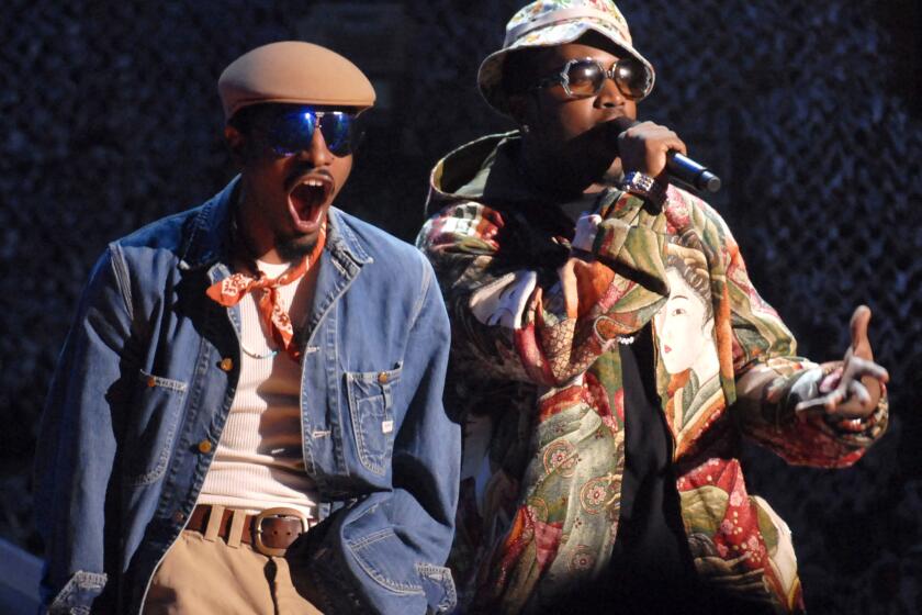 Andre "3000" Benjamin, left, and Antwan "Big Boi" Patton of Outkast perform in 2006.