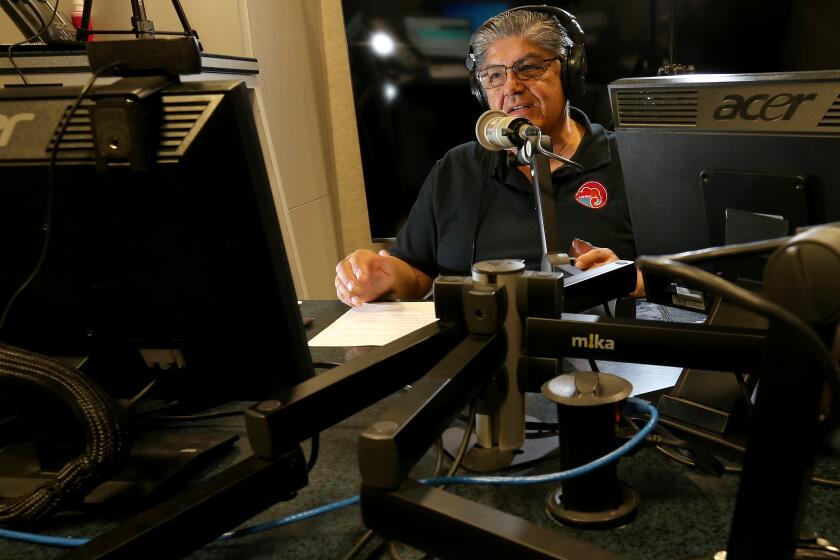 LOS ANGELES, CALIF. NOV. 5, 2022. David Hernadez moderates a conservative political radio talk show at the studios of AM Radio 870 in Southern California on Saturday night, Nov. 5, 2022. Hernandez is the chairman of the Los Angeles County Hispanic Republican Club. (Luis Sinco / Los Angeles Times)