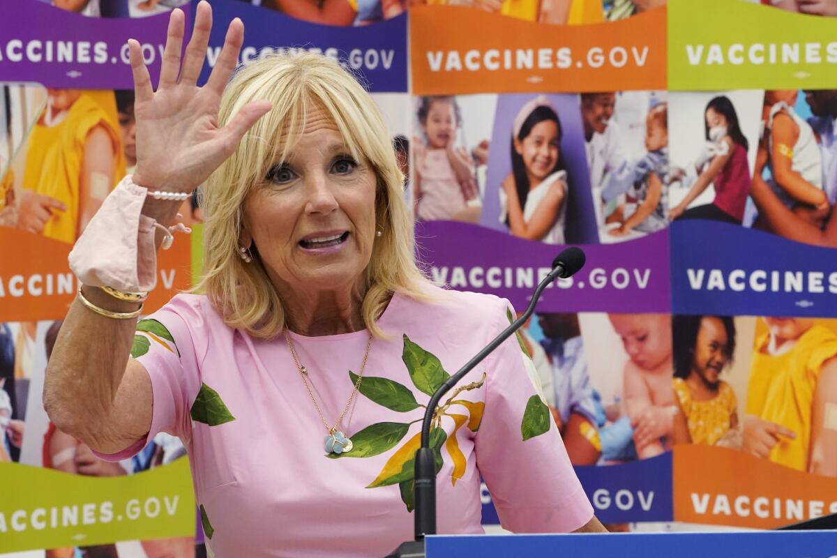 FILE - First lady Jill Biden waves as she speaks during a tour of a health facility, July 1, 2022, in Richmond, Va.