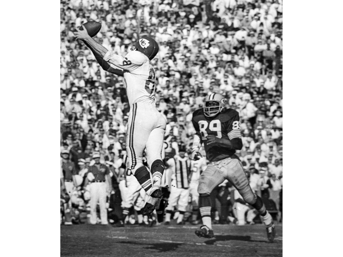 Jan. 15, 1967: Chiefs wide receiver Chris Burford goes for ball during first Super Bowl game at Los Angeles Memorial Coliseum. Packers linebacker Dave Robinson, 89, is on right.
