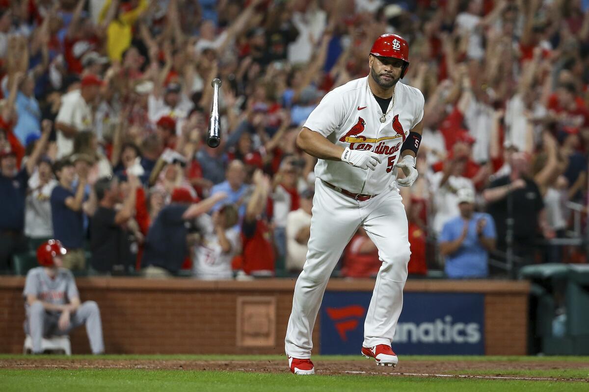 Albert Pujols hits 698th homer, helps Cards beat Reds 6-5