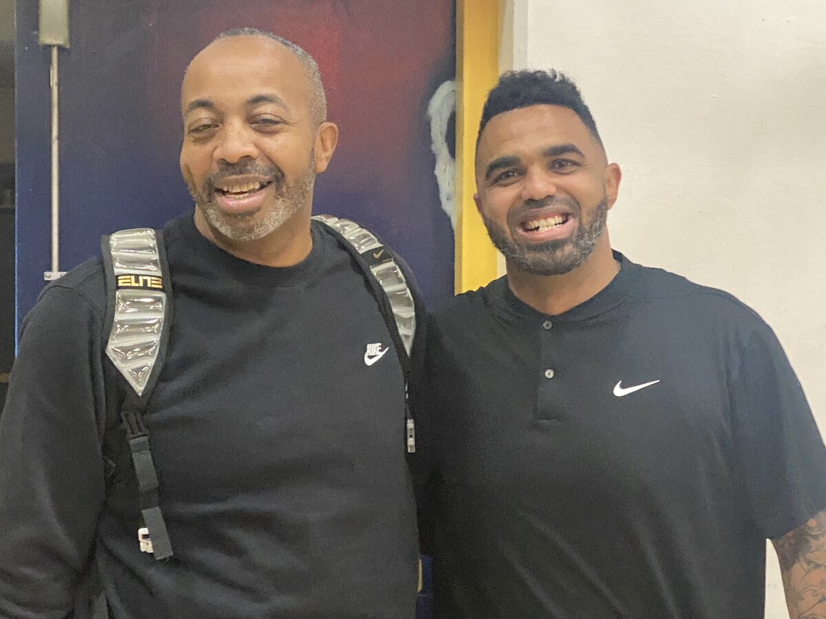 Taft coach Derrick Taylor, left, and Birmingham coach Nick Halic pose for a photo.