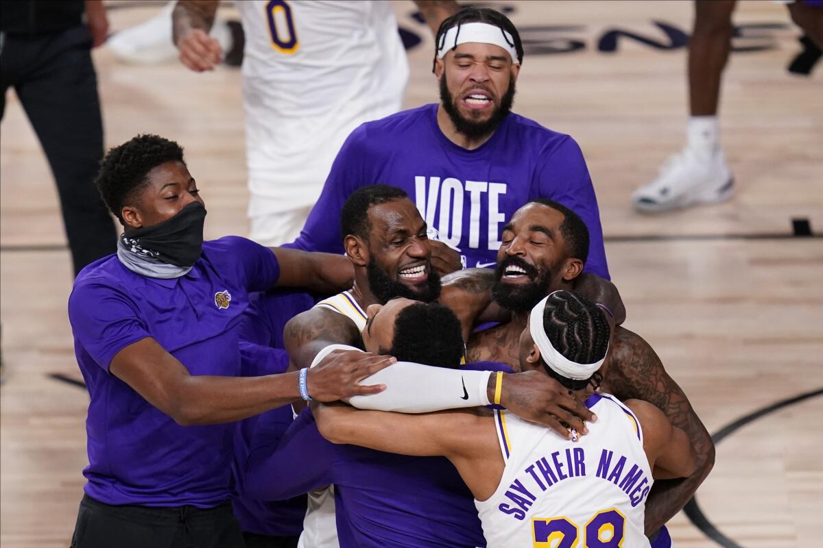 LeBron james and his Lakers teammate begin celebrating their 2020 NBA championship after defeating the Heat in Game 6.