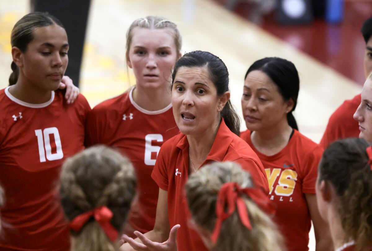 Cathedral Catholic coach Juliana Conn talks to her players during a timeout.