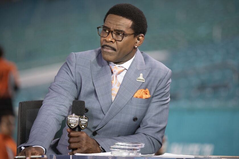 FILE - NFL Network analyst Michael Irvin speaks on air during the NFL Network's NFL GameDay Kickoff broadcast before the start of an NFL football game between the Baltimore Ravens and the Miami Dolphins, on Nov. 11, 2021, in Miami Gardens, Fla. Irvin has been pulled from the remainder of NFL Network's Super Bowl week coverage after a complaint about Irvin's behavior in a hotel Sunday night, Feb. 5, 2023.(AP Photo/Doug Murray, File)
