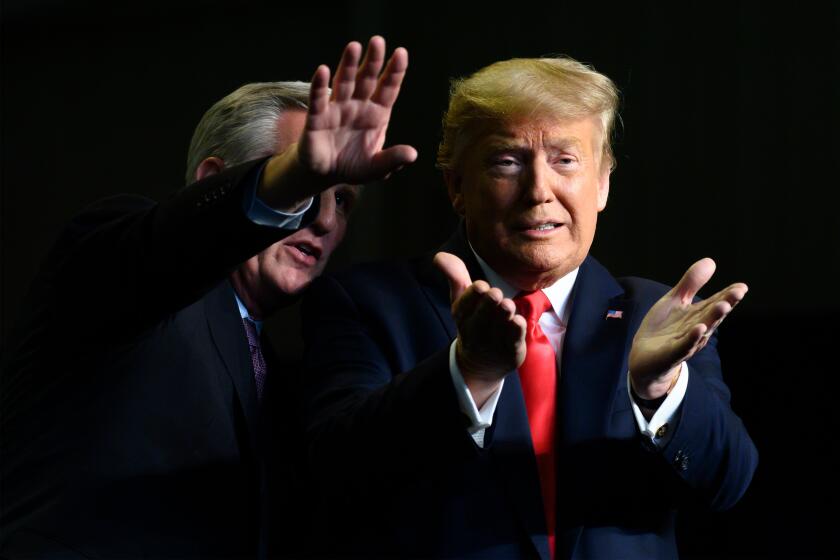 President Donald Trump gestures next to US Congressman Kevin McCarthy as they deliver remarks to Rural Stakeholders on California Water Accessibility in Bakersfield, California.