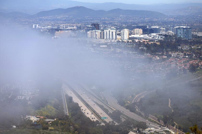 San Diego, CA - April 10: Fog envelops La Jolla and University City along Interstate 5 on Monday, April 10, 2023. (K.C. Alfred / The San Diego Union-Tribune)