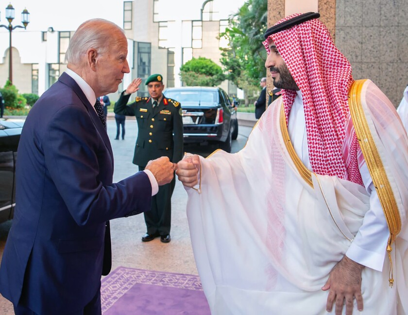 Crown Prince Mohammed bin Salman greets President Biden with a fist bump.