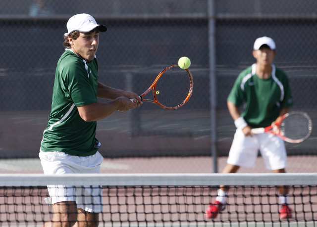 Sage Hill's Andrew Kurzweil returns a back hand while playing a match with his partner Ryan Lee against Cerritos' during the CIF Southern Section Division III semifinals at Cerritos High.
