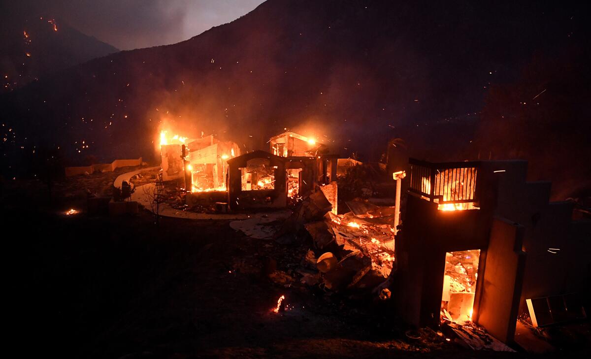 A house burns along Little Tujunga Canyon Road as the Sand fire rages near Santa Clarita.
