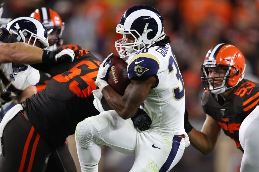 CLEVELAND, OHIO - SEPTEMBER 22: Todd Gurley #30 of the Los Angeles Rams battles for yards during a third quarter run while being tackled by Larry Ogunjobi #65 of the Cleveland Browns at FirstEnergy Stadium on September 22, 2019 in Cleveland, Ohio. (Photo by Gregory Shamus/Getty Images)