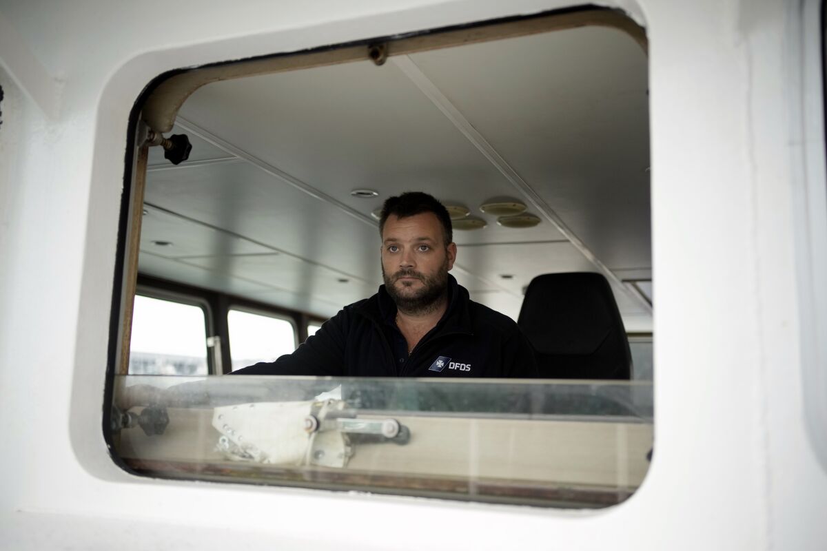 Pierre Yves Dachicourt, a French fisherman poses during a interview on his boat at the port of Boulogne-sur-Mer, northern France, Friday, Oct. 15, 2021. France wants more fishing licenses from London, but the UK is holding back. Britain's Brexit minister accused the EU of wishing failure on its former member and of badmouthing the U.K. as a country that can't be trusted. (AP Photo/Christophe Ena)