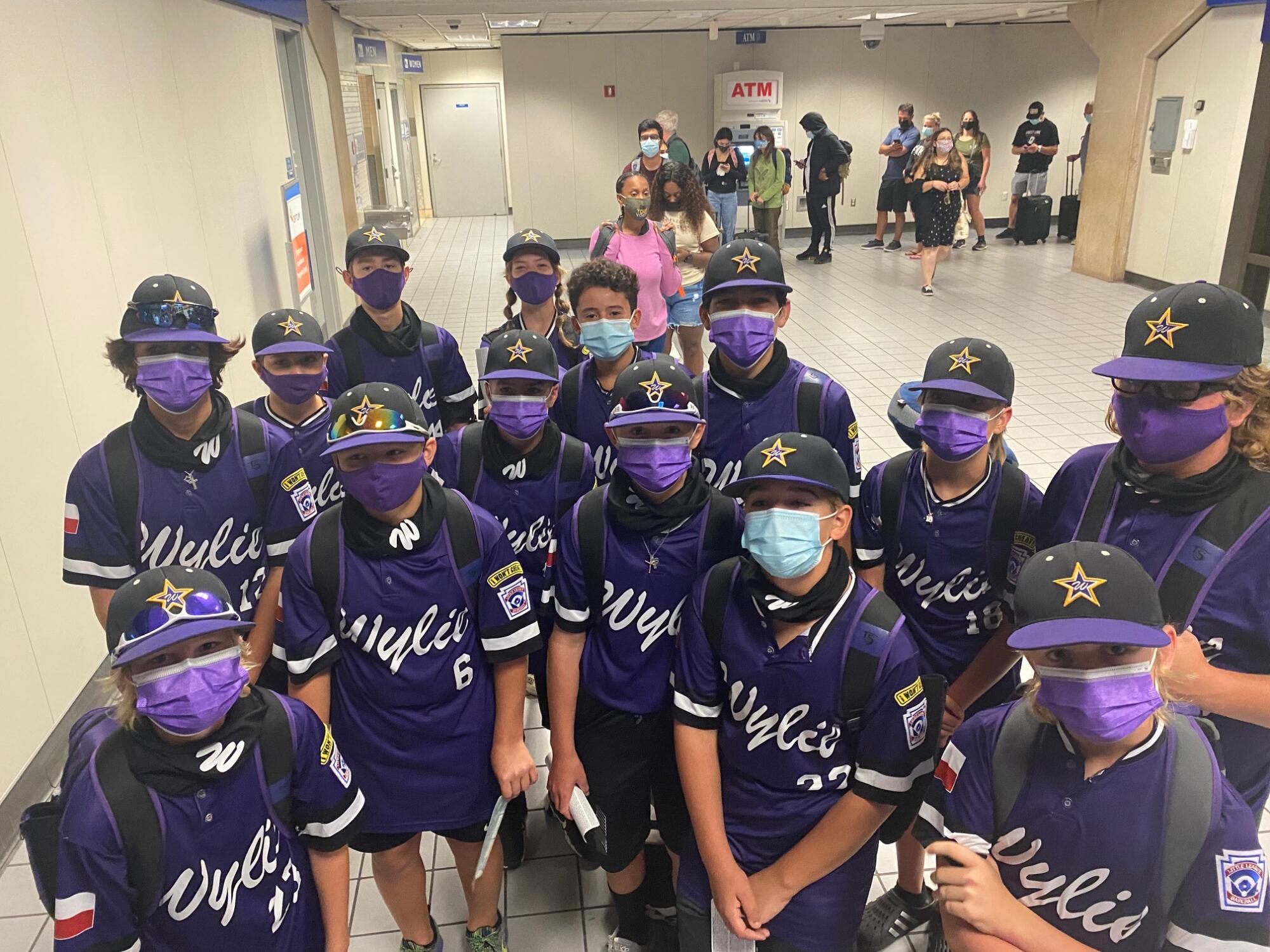 Wylie Little League players arrive at the airport