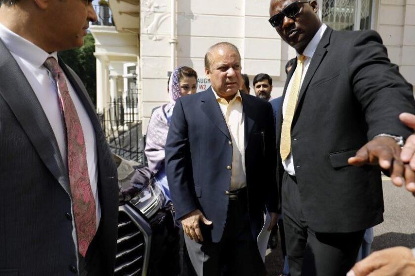 Pakistan's former prime minister Nawaz Sharif (C) arrives at his office in central London on July 6, 2018. Pakistan's former prime minister Nawaz Sharif was sentenced in absentia to 10 years in prison by a corruption court in Islamabad on July 6, 2018, lawyers said, dealing a serious blow to his party's troubled campaign ahead of July 25 elections. / AFP PHOTO / Tolga AKMENTOLGA AKMEN/AFP/Getty Images ** OUTS - ELSENT, FPG, CM - OUTS * NM, PH, VA if sourced by CT, LA or MoD **