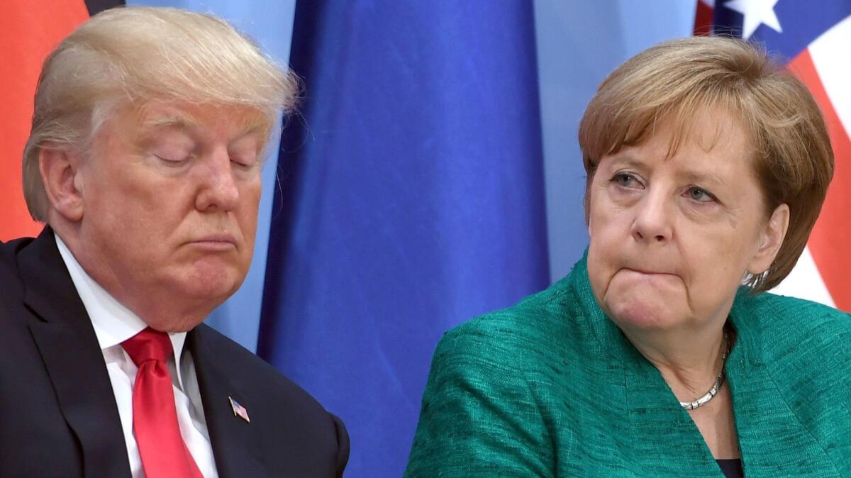 President Trump and German Chancellor Angela Merkel attend the launch event for the Women's Entrepreneur Finance Initiative on Saturday in Hamburg.