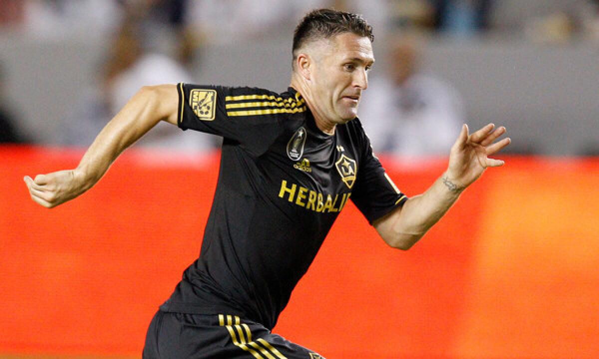 Galaxy forward Robbie Keane runs during a 2012 game against Chivas USA. The 33-year-old Irishman received a contract extension from the Galaxy on Wednesday following an impressive 2013 campaign.