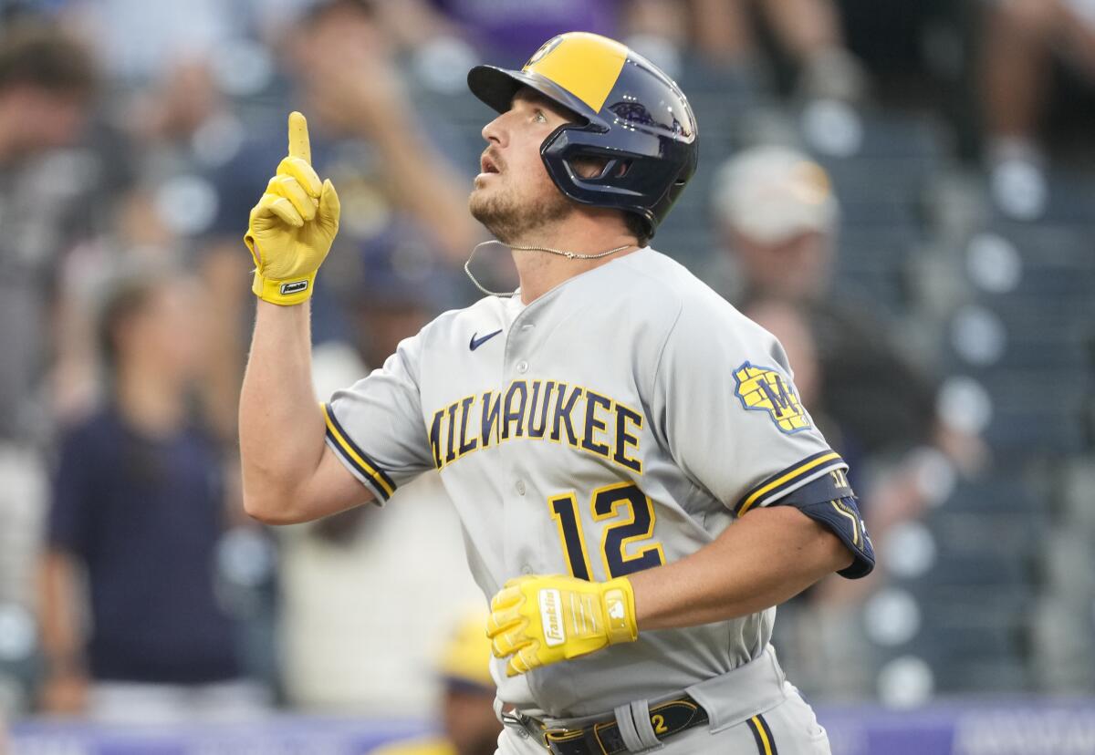 Milwaukee Brewers' Hunter Renfroe gestures as he circles the bases after hitting a two-run home run.
