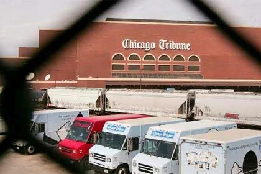 DISTRIBUTION: Trucks at the Chicago Tribune printing plant are ready to deliver papers throughout the city and suburbs. Decades ago, competition among the dailies was so intense that trucks would be hijacked and newspapers dumped into the Chicago River.