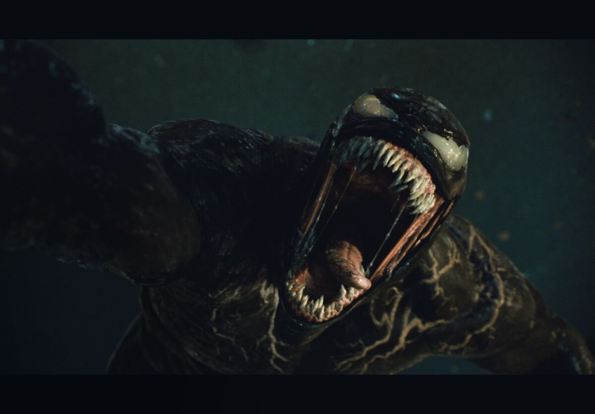 Tom Hardy stars as Venom, seen here sticking his long tongue out, in Columbia Pictures' "Venom: Let There Be Carnage."