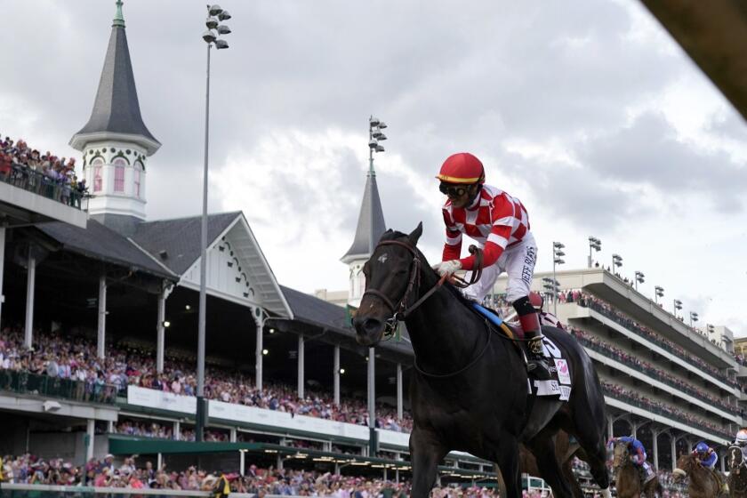 Jose Ortiz rides Serengeti Empress to victory during the 145th running of the Kentucky Oaks horse race at Churchill Downs Friday, May 3, 2019, in Louisville, Ky. (AP Photo/Matt Slocum)