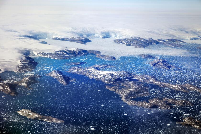 FILE - Icebergs float in a fjord after calving off from glaciers on the Greenland ice sheet in southeastern Greenland, Aug. 3, 2017. Climate change is going to get worse, but as gloomy as the latest scientific reports are, including today’s from the United Nations, scientist after scientist stress that curbing global warming is not hopeless. The science says it is not game over for planet Earth or humanity. Action can prevent some of the worst if done soon, they say. (AP Photo/David Goldman, File)