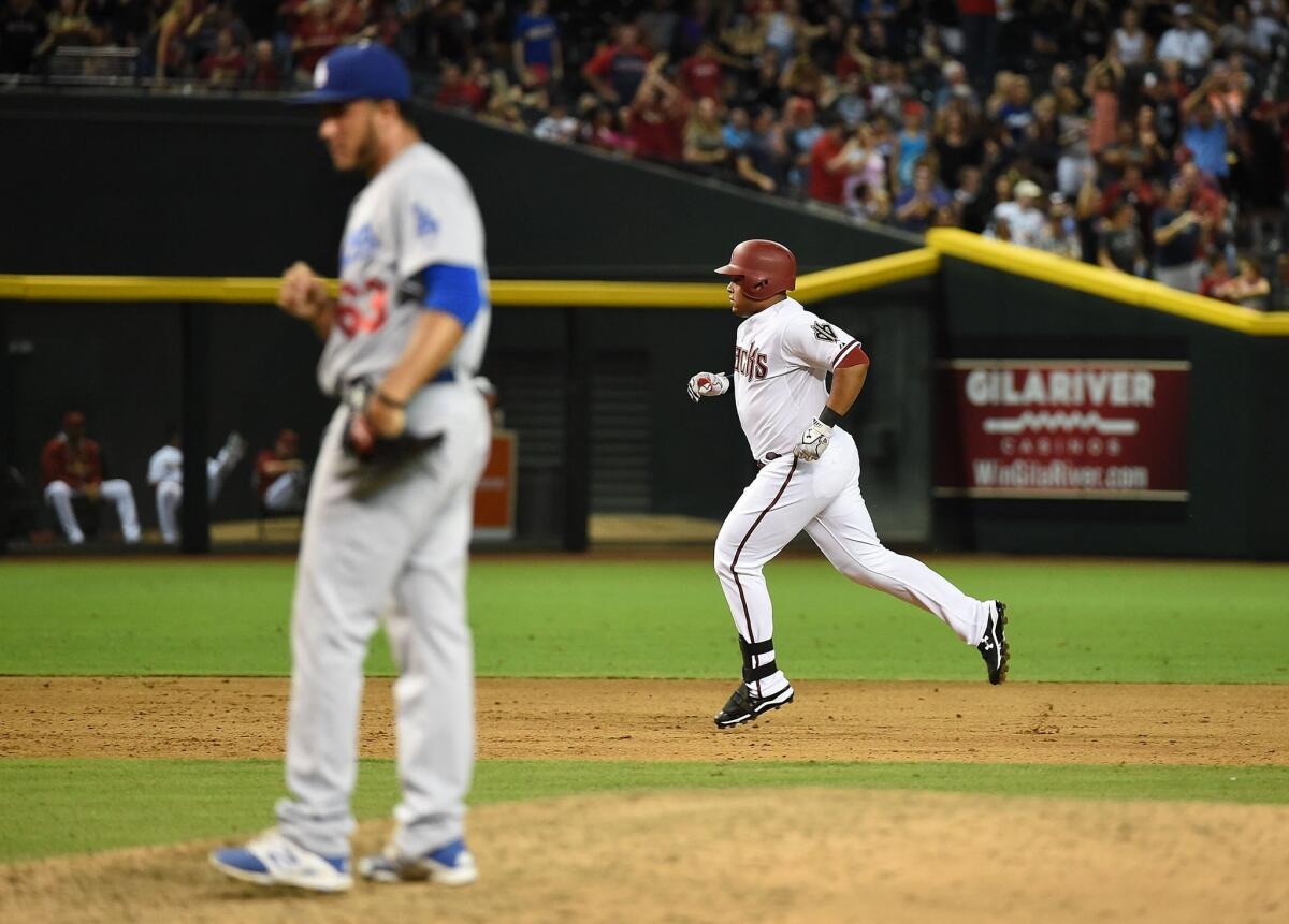 PHOENIX, AZ - JUNE 29: Yasmany Tomas #24 of the Arizona Diamondbacks rounds the bases after hitting a game-tying two-run home run during the sixth inning against the Los Angeles Dodgers at Chase Field on June 29, 2015 in Phoenix, Arizona. (Photo by Norm Hall/Getty Images) ** OUTS - ELSENT, FPG - OUTS * NM, PH, VA if sourced by CT, LA or MoD **