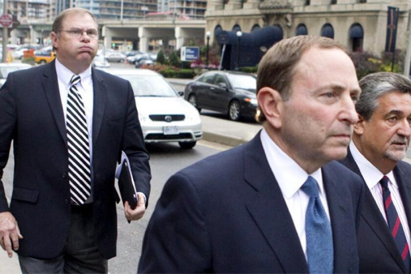 Craig Leipold, left, owner of Minnesota Wild, follows NHL Commissioner Gary Bettman, center, and Washington Capitals owner Ted Leonsis after a collective bargaining meeting in Toronto in October.