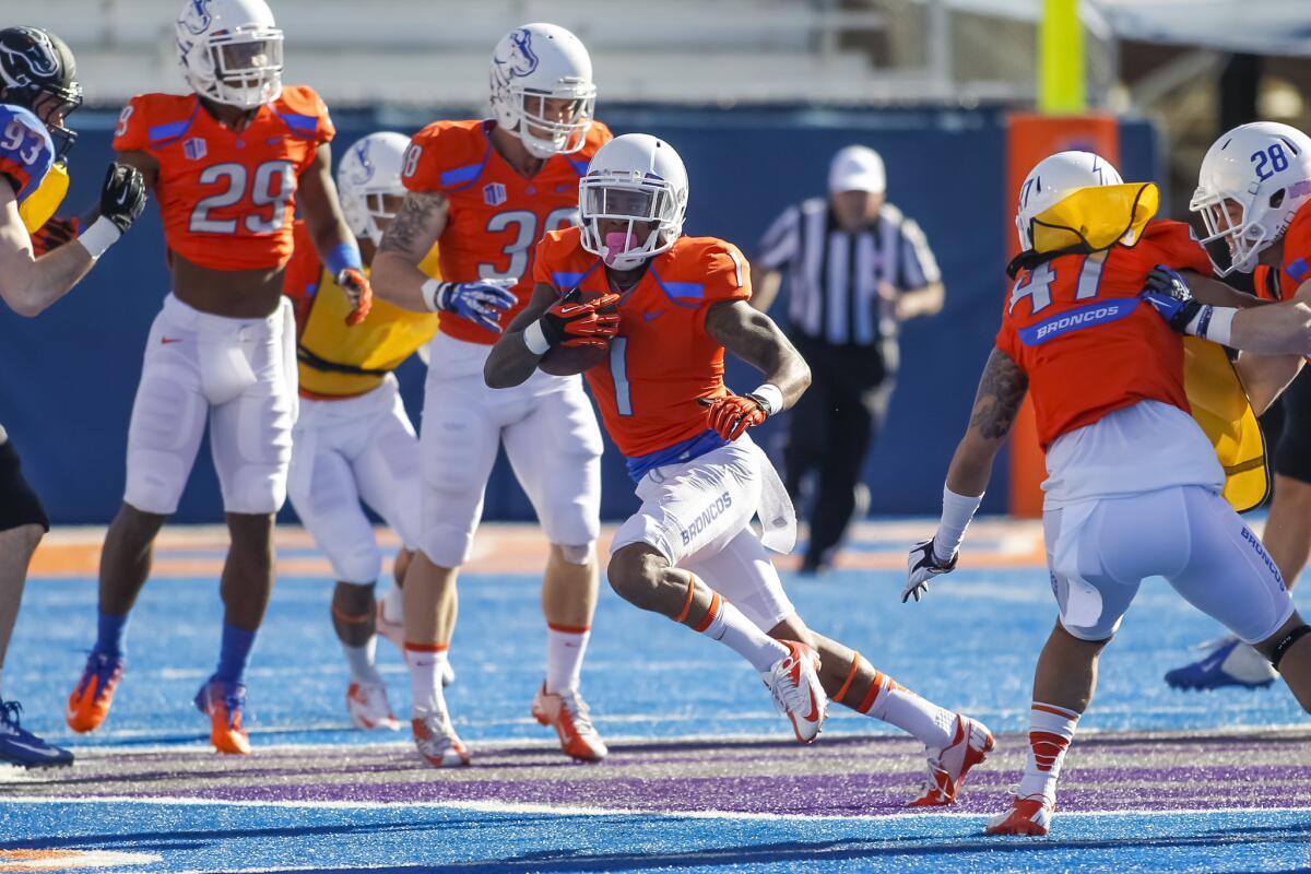 Boise State cornerback Bryan Douglas runs the opening kickoff back for a touchdown during a scrimmage on April 12.