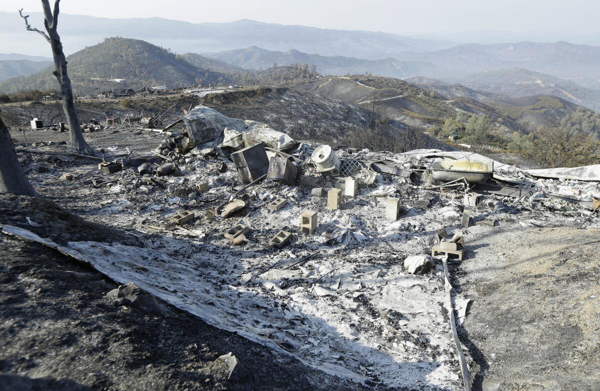 The charred remains of a property near Clearlake, Calif., are seen on Aug. 6. Federal, state, and county fire agencies currently spend almost $5 billion a year fighting fires.