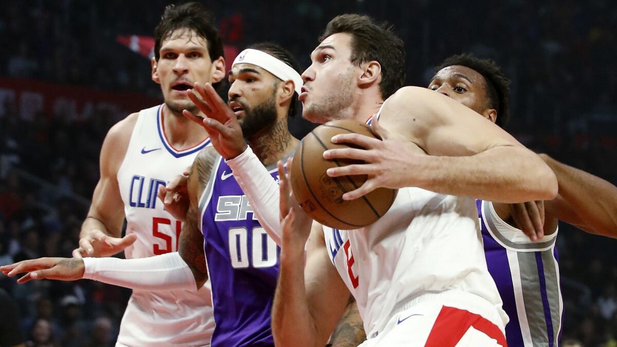 Clippers forward Danilo Gallinari drives to the basket against Sacramento Kings guard Buddy Hield in the second quarter on Wednesday at Staples Center.