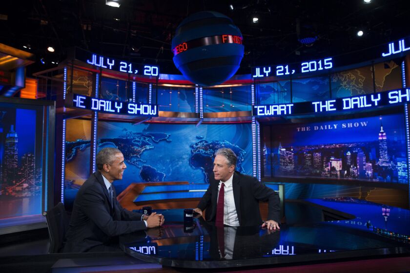 President Obama talks with Jon Stewart, host of "The Daily Show," during Tuesday's taping in New York. It is Obama's third appearance on the show as president and seventh appearance overall.