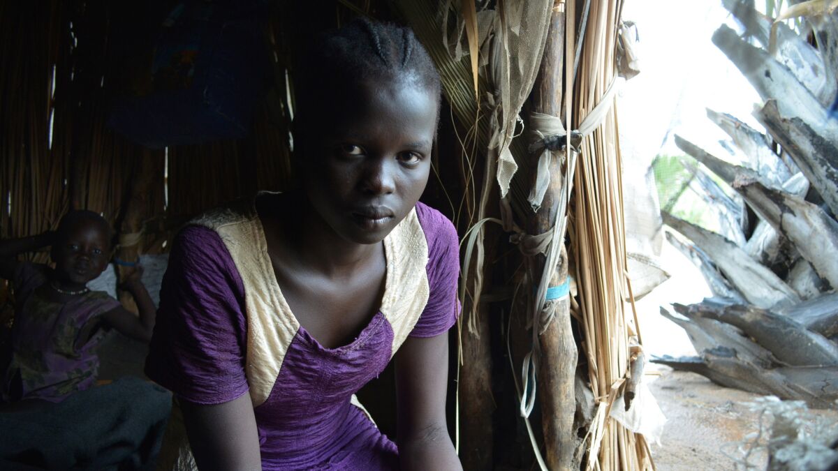 Margaret Nyamuka, 18, fled the town of Mayendit when soldiers attacked last year, going from house to house, shooting civilians.