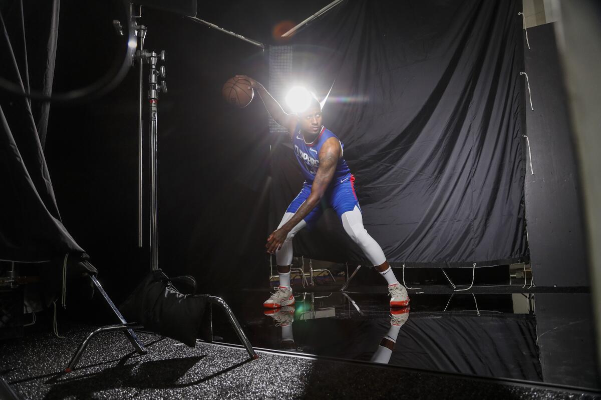 Clippers forward Paul George is photographed in a makeshift studio on the team's practice court.
