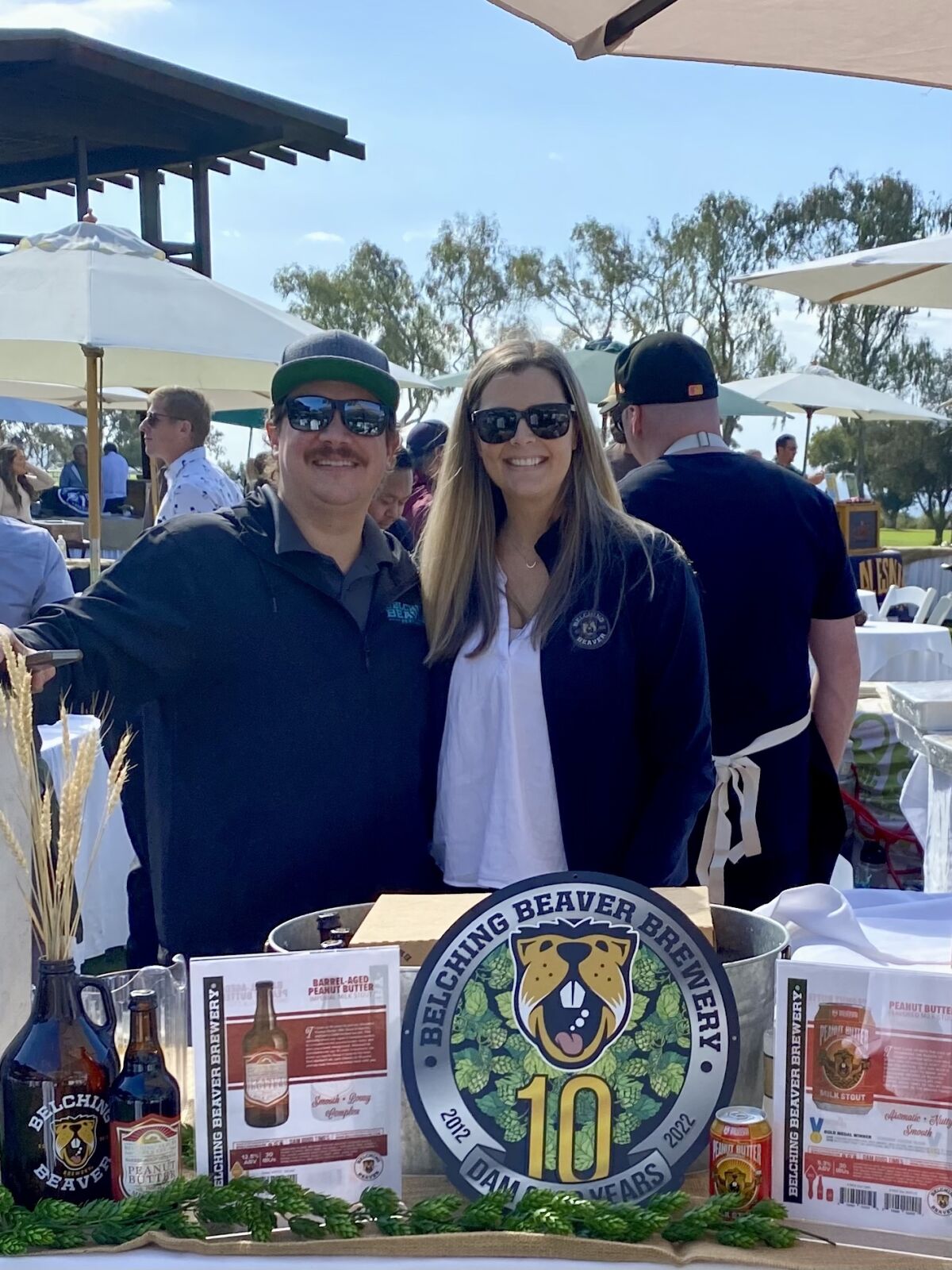 Husband and wife Troy and Haley Smith of Belching Beaver Brewery attend an event promoting the business. 