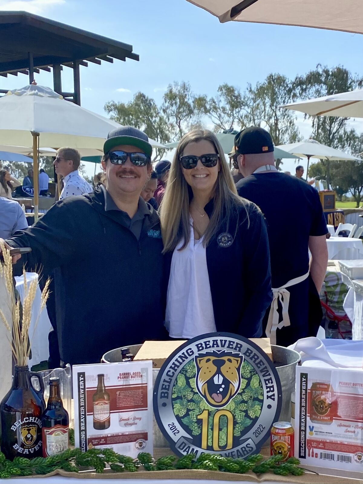 Husband and wife Troy and Haley Smith of Belching Beaver Brewery attend an event promoting the business.