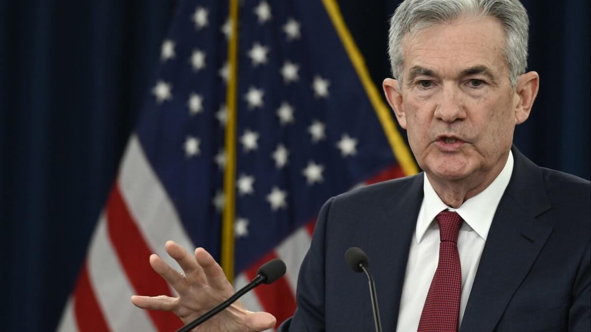 Federal Reserve Chairman Jerome H. Powell speaks at a news conference in Washington, D.C., on Dec. 19 after the central bank raised interest rates a quarter of a point.